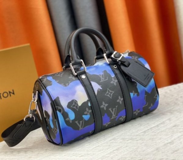 Replica Louis Vuitton Monogram Eclipse Keepall Bandouliere 25 Travel Bag In Blue And Purple Sunrise - Image 2