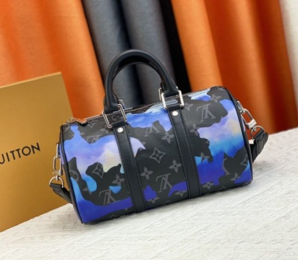 Replica Louis Vuitton Monogram Eclipse Keepall Bandouliere 25 Travel Bag In Blue And Purple Sunrise - Image 3