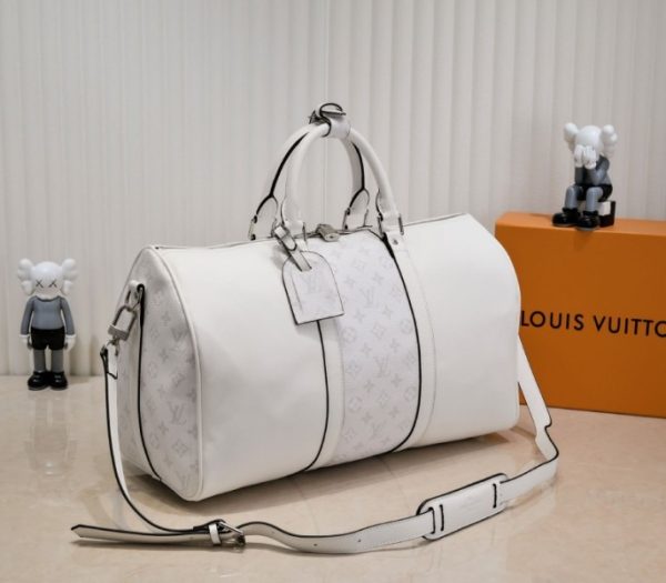 Replica Louis Vuitton Taiga Leather Keepall Bandouliere 50 Travel Bag In White - Image 2