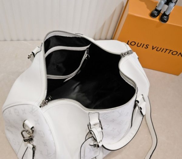 Replica Louis Vuitton Taiga Leather Keepall Bandouliere 50 Travel Bag In White - Image 5